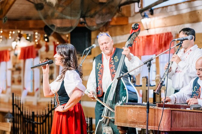 Folk Dinner Experience in Prague with Transportation - Folk music, costumes, and audience dancing