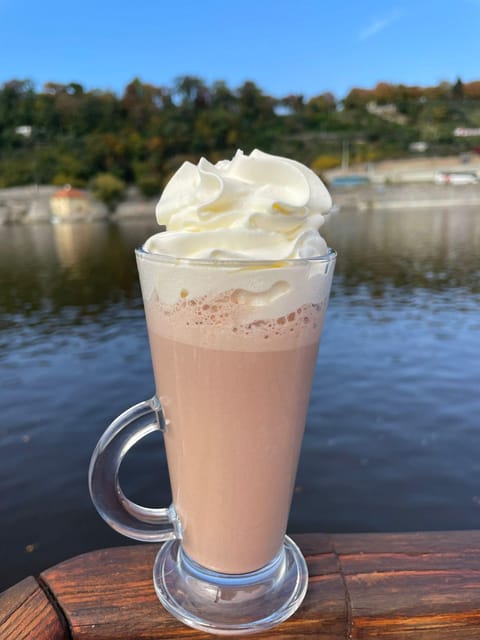 Prague: Advent Boat Cruise with Sweets and Hot Drinks - Prague from the river during Advent