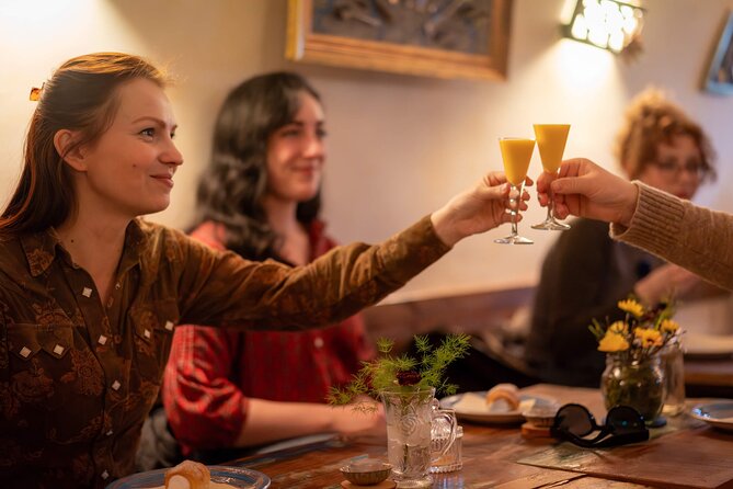 Prague by Night: Drinks & Food Tour with Eating Europe - Bread, garlic spread, and beer near Charles Bridge