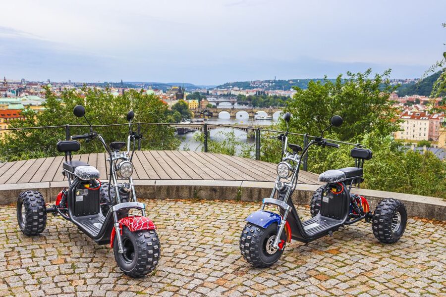 Prague City sightseeing in Night Trike Tour - John Lennon Wall and the Charles Bridge view