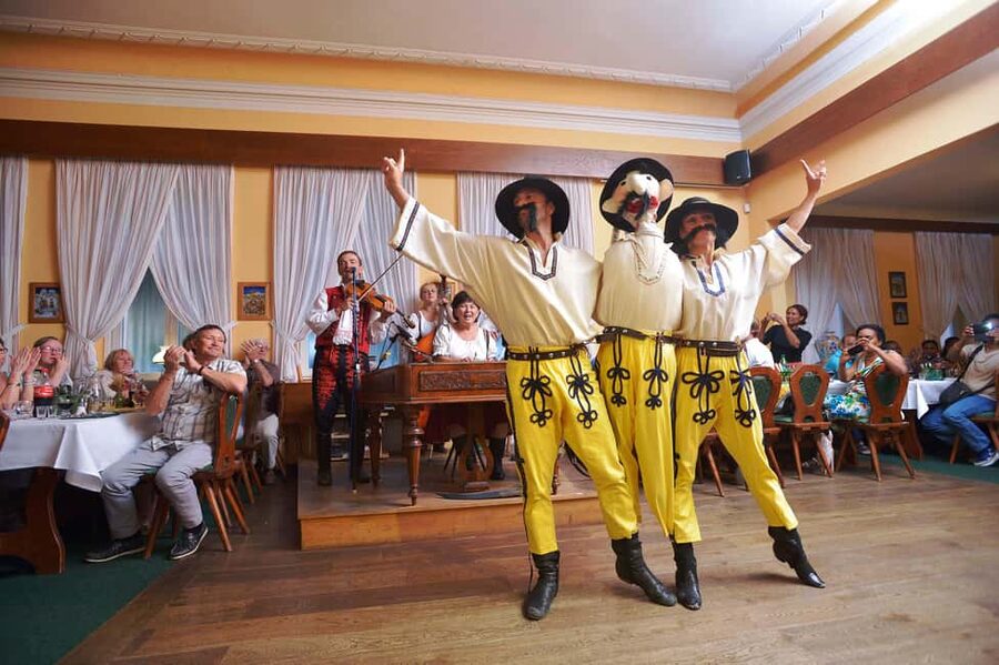 Prague: Folk Dancing Dinner Experience - Entering the decorated folk restaurant