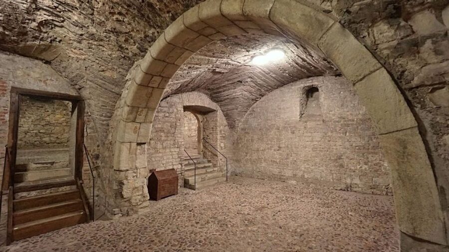 Prague: Medieval Underground Guided Tour - Entering the medieval rooms beneath the town hall