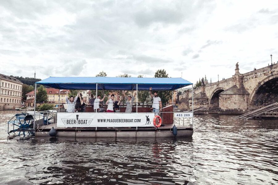 Prague: Private Cycle Boat River Tour with Beer or Prosecco - Finding the blue-roofed boat by the river