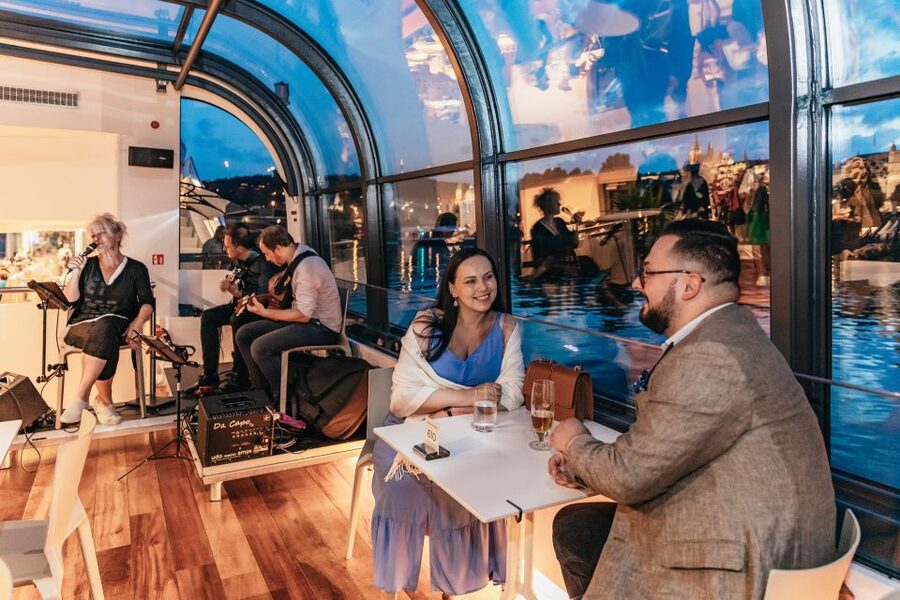 Prague: Sightseeing Dinner Cruise on Open-Top Glass Boat - Choosing the right seat for the views